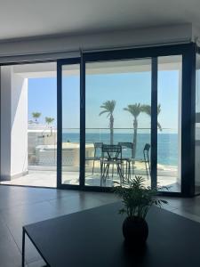 a living room with a view of the ocean at Sea La Vie #2 - Luxury Seaview apartment in Paphos City