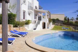 a swimming pool in front of a villa at Villa Bahia Dor 15 in Portopetro