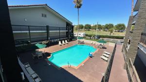 an overhead view of a swimming pool at a building at Days Inn by Wyndham San Diego Vista in Vista