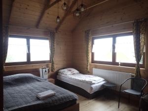Posteľ alebo postele v izbe v ubytovaní Agroturystyka Góra Fiedora