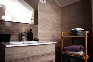 a bathroom with a sink and a mirror at Timeless in Gospić