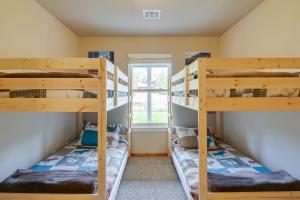 two bunk beds in a room with a window at Crested Butte Getaway Near Skiing and Shopping! in Crested Butte