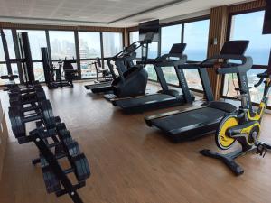 a gym with a bunch of exercise equipment in a building at Barra Pinauna Studio in Salvador