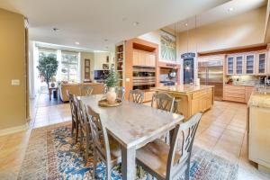 a kitchen and dining room with a table and chairs at Chic California Escape with Pool, Hot Tub and Patio! in Salinas