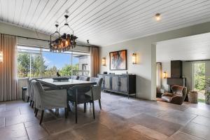 a dining room with a table and chairs at Hvoll Villa in Ölfus