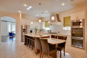 a large kitchen with a table and chairs in it at Spacious Amarillo Home 6 Mi to Downtown! in Amarillo