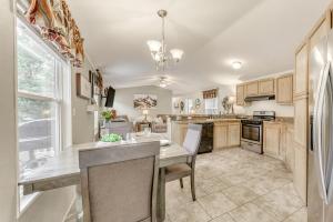 a kitchen with a table and chairs in a room at Peaceful Cloudcroft Vacation Rental Walk to Shops in Cloudcroft