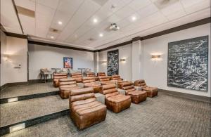 a conference room with leather chairs and a table at New Apartment in Houston in Houston