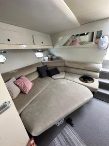 a small room with a couch in a trailer at Boat in Puerto de Mogán in Puerto de Mogán