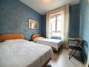 Postel nebo postele na pokoji v ubytování Hotel Molise 2 + 36 fotografií