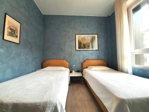 Postel nebo postele na pokoji v ubytování Hotel Molise 2