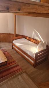 Posteľ alebo postele v izbe v ubytovaní Magma Lodge, Pucon