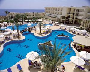 an overhead view of a resort swimming pool at DoubleTree by Hilton Sharks Bay Resort in Sharm El Sheikh