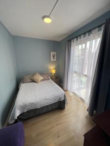 Cama ou camas em um quarto em Hostal Ravello