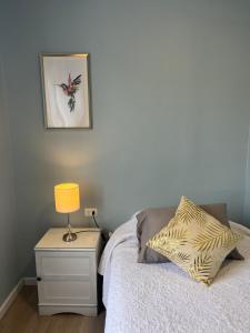 Cama ou camas em um quarto em Hostal Ravello