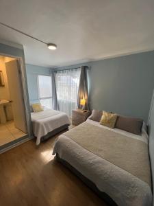 Cama ou camas em um quarto em Hostal Ravello