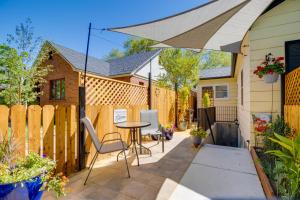 a patio with a table and chairs and an umbrella at Heart of Reno Studio about 1 Mi to Downtown! in Reno