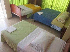 Кровать или кровати в номере Hotel Villa Santa Ana