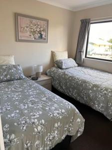 Llit o llits en una habitació de Benn Rd Cottage