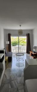 a living room with a couch and a table at Estudio Altamira 128 - Tenerife in Adeje