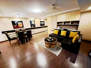 a living room with a couch and a dining room at 3B-Short-term rental allowed-2BRs Downtown Bangkok in Bang Kapi