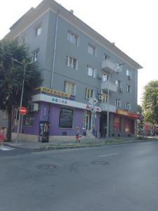 a large building on the corner of a street at Стеди - стая за гости in Varna City