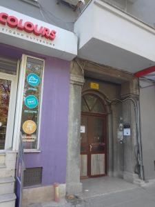 a purple building with a sign on the side of it at Стеди - стая за гости in Varna City