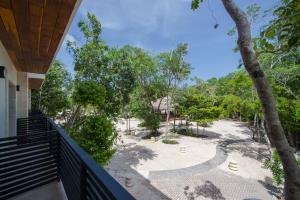 a view from the balcony of a house at Naay Tulum Curamoria Collection in Tulum