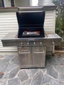 a barbecue grill sitting on a stone patio at Upscale Downtown Home Walk to Beach shops Bars 2 in Santa Barbara