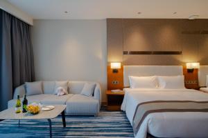 Voodi või voodid majutusasutuse Horizon Hotel toas