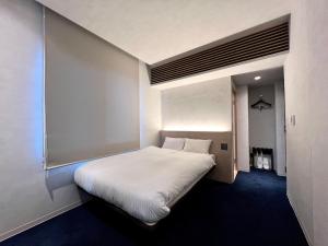 Postel nebo postele na pokoji v ubytování ABiz hotel