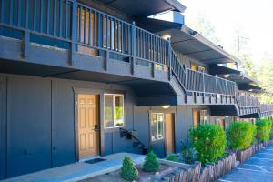 a building with a staircase on the side of it at Sessions Retreat & Hotel in Big Bear Lake