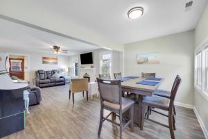 a dining room and living room with a table and chairs at Beachy Keen, North Myrtle Beach beach single-family house, 150 feet to ocean! Pets welcome! in Myrtle Beach