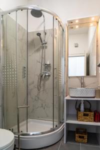 a shower stall in a bathroom with a sink at Sunny terrace in Split
