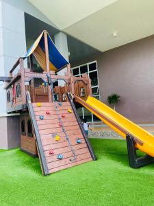 a play room with a slide and a playground at Wind Residences Apt. 1506 Tagaytay in Tagaytay