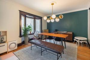 a dining room with a table and chairs in a room at Cozy 3 bedroom house with office in Kitchener