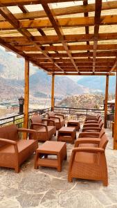 a row of chairs and tables on a patio at Lhayhuel Resort and Spa in Paro