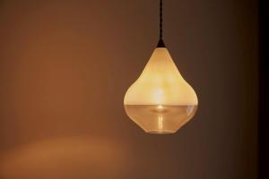 a light bulb hanging from a ceiling at tamao-たま靑- in Kyoto +42 photos