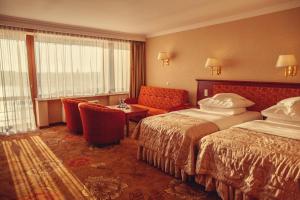 Posteľ alebo postele v izbe v ubytovaní Hotel Gołębiewski Mikołajki