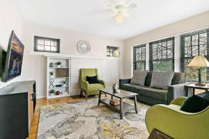 a living room with a couch and a table at Beautiful 1BR Brick Home in Historic Hyde Park in Chicago