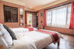 Letto o letti in una camera di Shivapuri Heights Cottage