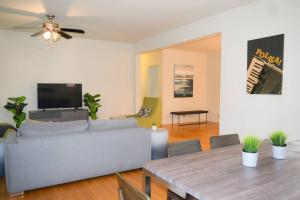 a living room with a couch and a table at Stunning 3BR Chicago Apt close to Shopping Center in Chicago