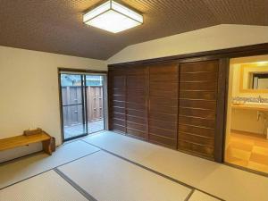 Postel nebo postele na pokoji v ubytování Asuka no yado-明日香の宿-