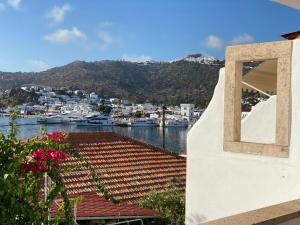 a view of a harbor with boats in the water at Petridi Maria Suites & Apartments in Patmos