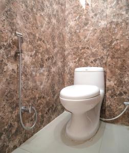 a bathroom with a toilet in a shower stall at Soham Haveli - A Lake Facing Stay in Udaipur in Udaipur
