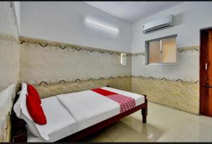 Postel nebo postele na pokoji v ubytování RK RESIDENCY INN + 2 fotografie
