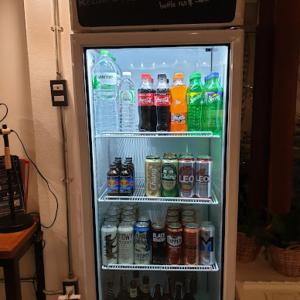an open refrigerator filled with lots of drinks at Baan Heart Thai in Chiang Mai