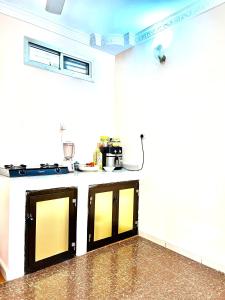 a kitchen with a counter in a room at Nakupenda in Mazizini