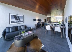 a living room with a couch and a table at Kamo Residences by Reflections in Kyoto