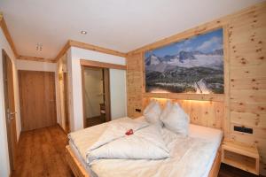 Postel nebo postele na pokoji v ubytování Krölls Alpenchalet + 2 fotografie